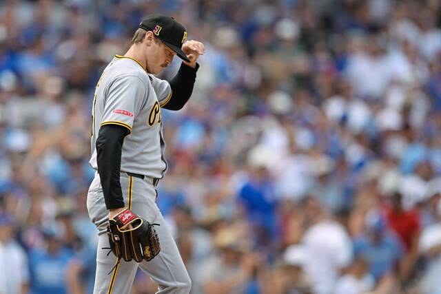 Pirates relief pitcher Evan Sisk reacts after giving up an RBI single to the Cubs’ Seiya Suzuki during the eighth inning Saturday.