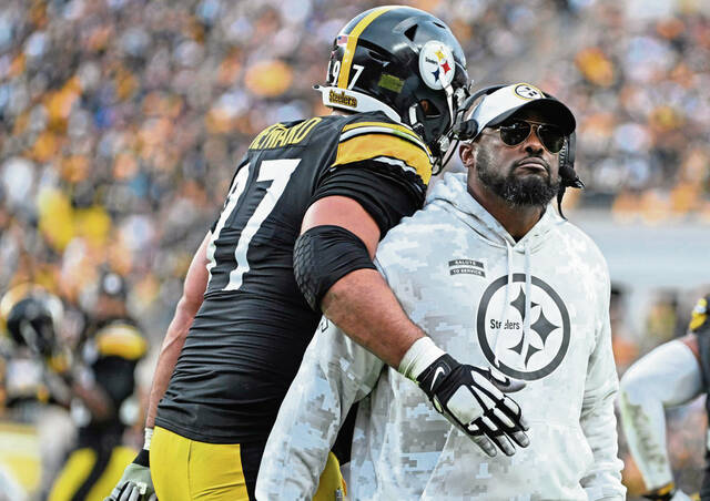 The Steelers’ Cameron Heyward celebrates with head coach Mike Tomlin after beating the Ravens on Nov. 17, 2024, at Acrisure Stadium.