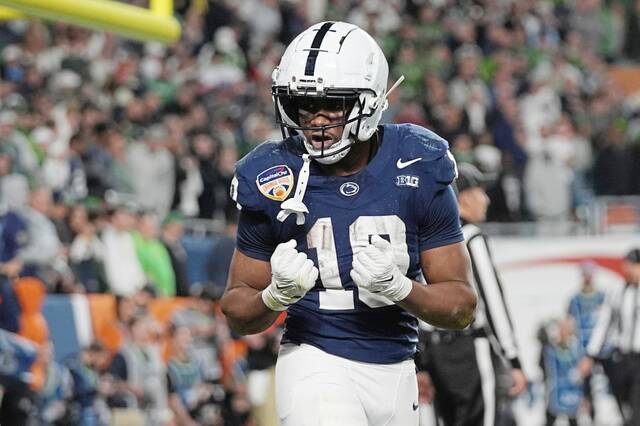 Penn State running back Nicholas Singleton (10) celebrates after scoring a touchdown during the second half of the Orange Bowl College Football Playoff semifinal game against Notre Dame, Thursday, Jan. 9, 2025, in Miami Gardens, Fla.