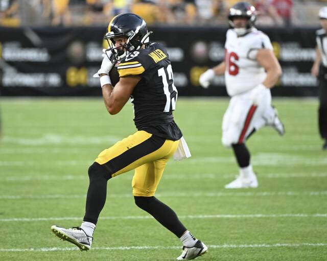 Pittsburgh Steelers wide receiver Scotty Miller makes a reception during this past Saturday’s preseason game against the Tampa Bay Buccaneers at Acrisure Stadium. Miller is on the roster bubble at a position group affected by injury and not considered deep.