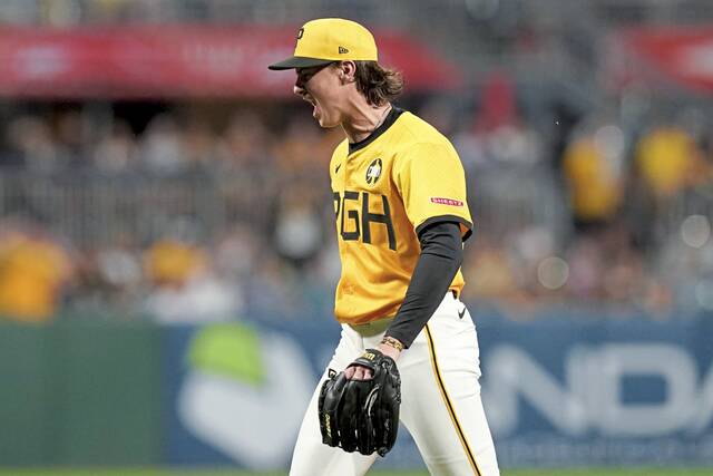 Pirates pitcher Bubba Chandler reacts after getting the Rockies’ Mickey Moniak to strike out to end the sixth inning Friday.