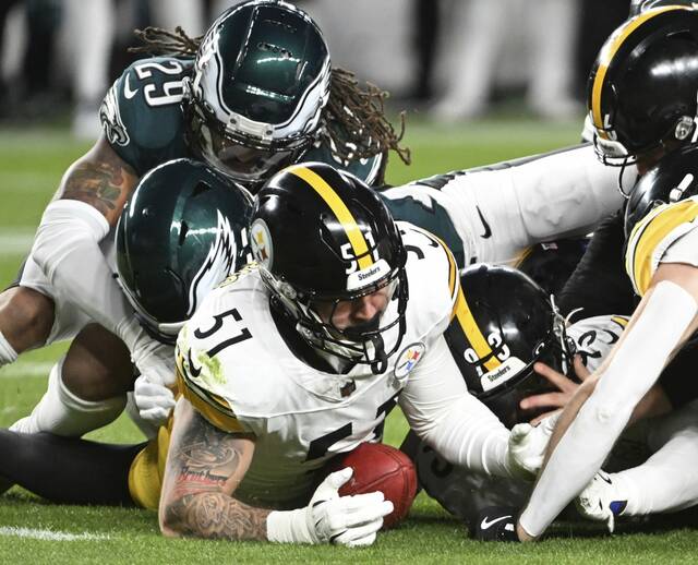 The Steelers’ Nick Herbig recovers a fumble on a punt return against the Eagles during a game in December.