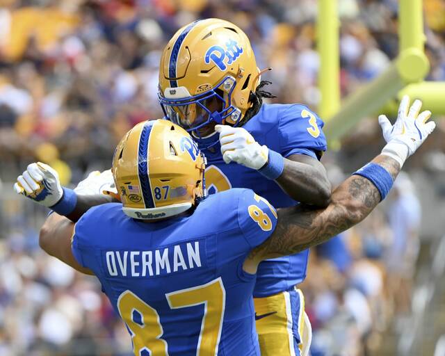 Pitt’s Cataurus Hicks celebrates his touchdown with Jake Overman against Duquesne on Saturday, Aug. 30, 2025, at Acrisure Stadium.