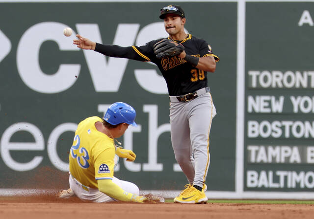 Pirates second baseman Nick Gonzales tags out Boston’s Romy Gonzalez and then throws on an attempted double play during the fourth inning Saturday.