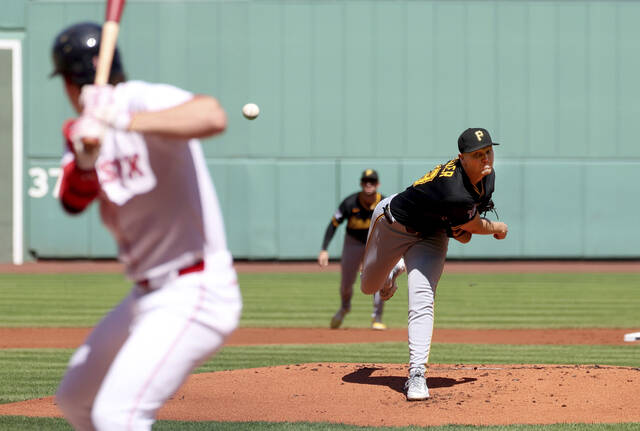 Pirates pitcher Mitch Keller throws during the first inning of a baseball game against the Boston Red Sox, Sunday, in Boston.