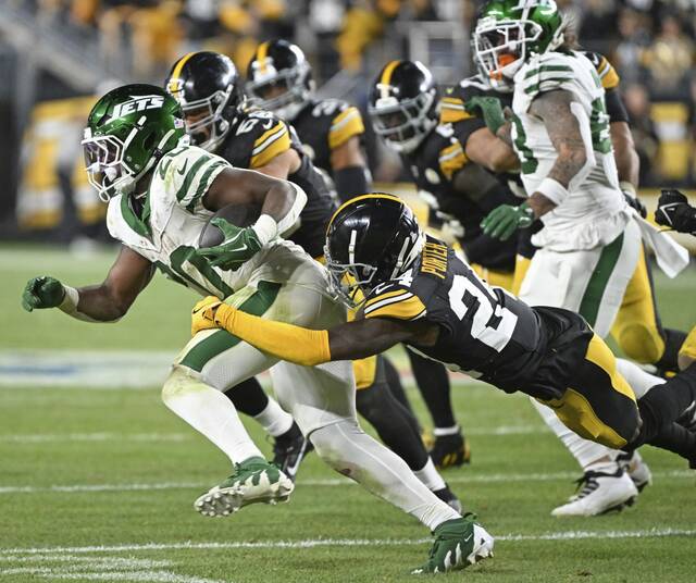 Steelers cornerback Joey Porter Jr. drops the Jets’ Breece Hall for a loss in the fourth quarter Oct. 20, 2024 at Acrisure Stadium.