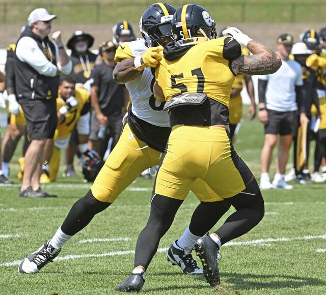 Pittsburgh Steelers outside linebacker Nick Herbig (No. 51) practices a pass rush move during a training-camp practice last month at Saint Vincent College. Herbig entered the weekend as questionable to play in Sunday’s season opener at the New York Jets.