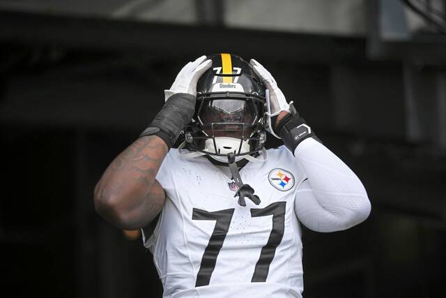 Pittsburgh Steelers’ Broderick Jones walks onto the field before an NFL football game against the New York Jets Sunday, Sept. 7, 2025, in East Rutherford, N.J.