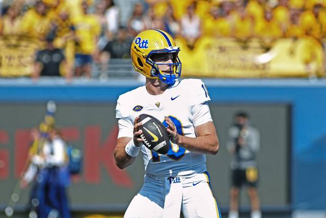 Pitt Panthers quarterback Eli Holstein (10) passes during the first half of an NCAA college football game against West Virginia Saturday, Sept. 13, 2025, in Morgantown, W.Va.