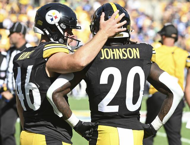 Pittsburgh Steelers long snapper Christian Kuntz consoles running back Kaleb Johnson after Johnson’s flub on a kickoff return during Sunday’s game against the Seattle Seahawks at Acrisure Stadium.