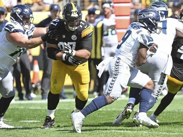 Seahawks running back Kenneth Walker III bursts past the Steelers’ Cam Heyward in the third quarter Sunday, Sept. 14, 2025 at Acrisure Stadium.