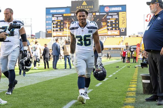 Seattle Seahawks running back George Holani (36) exits the field after an NFL football game, Sunday, Sept. 14, 2025, in Pittsburgh. 
                                Seattle Seahawks running back George Holani (36) exits the field after an NFL football game, Sunday, Sept. 14, 2025, in Pittsburgh.