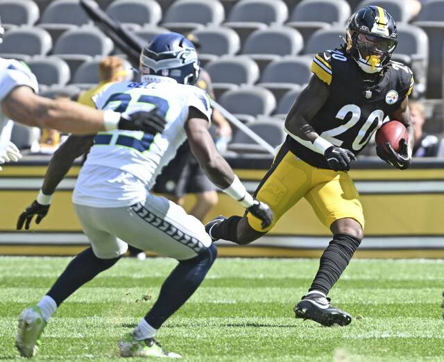 Steelers running back Kaleb Johnson returns a kickoff against the Seahawks on Sunday.