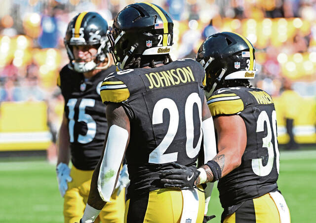 Steelers running back Jalen Warren consoles Kaleb Johnson who failed to cover a kickoff against the Seahawks on Sunday at Acrisure Stadium.