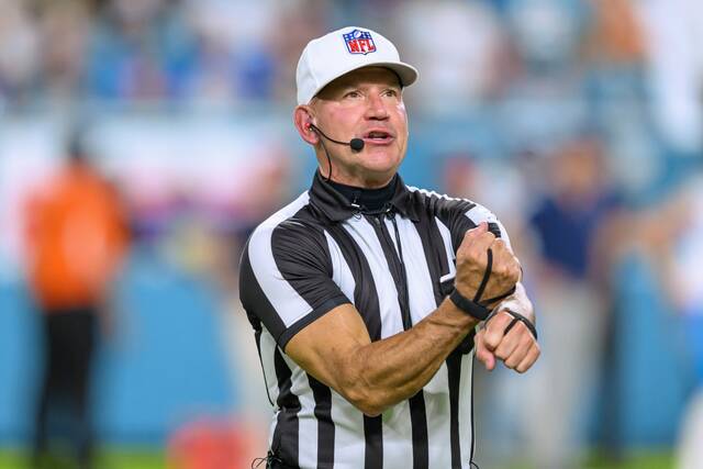 NFL referee Clete Blakeman makes a call during the Sept. 30, 2024, game between the Tennessee Titans and the Miami Dolphins in Miami Gardens, Fla.