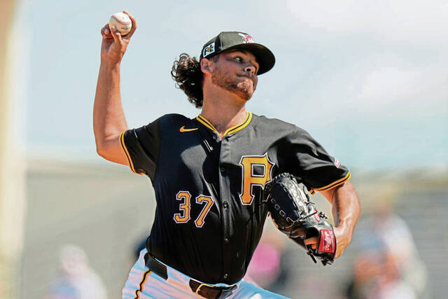 Pittsburgh Pirates starting pitcher Jared Jones (37) delivers during the first inning of a spring training baseball game against the Atlanta Braves, Tuesday, Feb. 25, 2025, in Bradenton, Fla.
