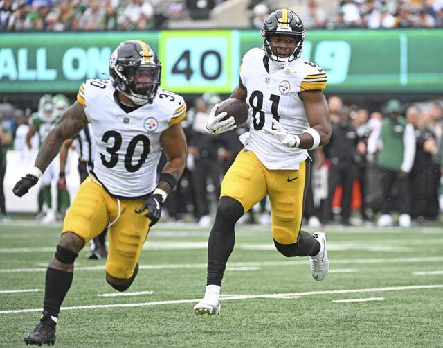 Pittsburgh Steelers running back Jalen Warren serves as a lead blocker during tight end Jonnu Smith’s touchdown in the Sept. 7 victory against the New York Jets. The play was the first of four consecutive successful red-zone trips to start the season for the Steelers.