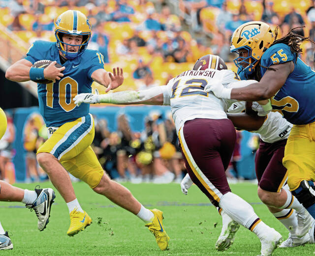 Pitt quarterback Eli Holstein (10) looks for room to run amidst pressure from Central Michigan's Jordan Kwiatkowski (12) on Saturday, Sept. 6, 2025, at Acrisure Stadium.