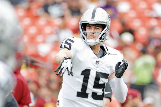 Raiders quarterback Kenny Pickett warms up Sept. 21 before a game against the Commanders at Northwest Stadium, just east of Washington.