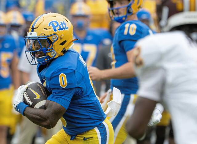 Pitt running back Desmond Reid (0) looks for room to run against Central Michigan on Saturday, Sept. 6, 2025, at Acrisure Stadium.