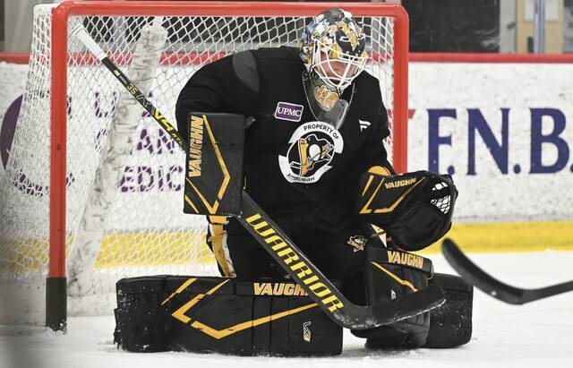 Penguins goaltender Tristan Jarry makes a save during practice at the UPMC Lemieux Sports Complex in Cranberry on Sept. 18.
