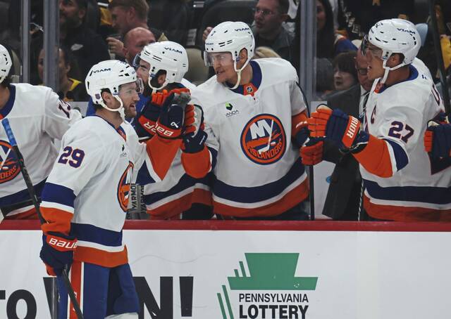 New York Islanders forward Jonathan Drouin (No. 29) celebrates a goal with teammates during a game against the Penguins at PPG Paints Arena on Thursday.