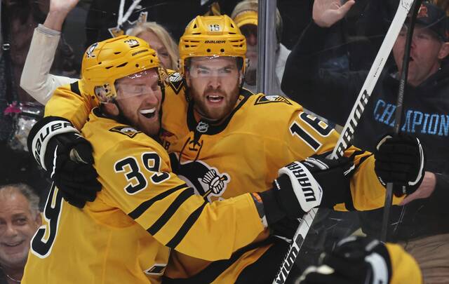 Penguins forwards Anthony Mantha (left) and Justin Brazeau celebrate a goal during a 4-3 home win against the New York Islanders at PPG Paints Arena on Thursday.
