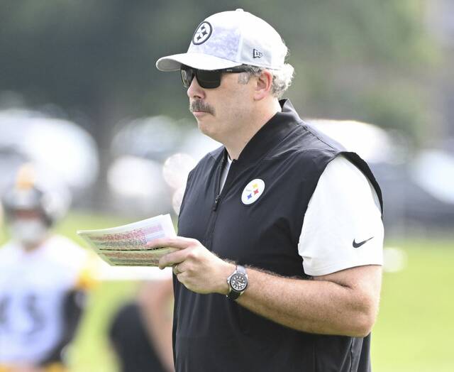 Steelers offensive coordinator Arthur Smith watches a training camp practice on July 31 at Saint Vincent College.