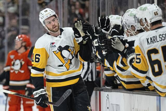 Penguins right wing Justin Brazeau celebrates his goal with the bench during the first period against the Anaheim Ducks on Tuesday.