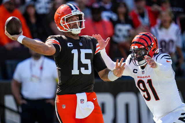Browns quarterback Joe Flacco is chased through the end zone by Bengals defensive end Trey Hendrickson on Sept. 7 in Cleveland.