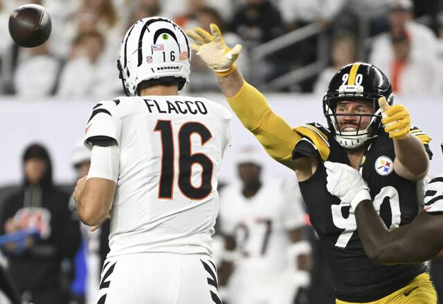 Cincinnati Bengals quarterback Joe Flacco gets a pass off before Pittsburgh Steelers outside linebacker T.J. Watt can get him during Thursday’s Bengals victory at Paycor Stadium.