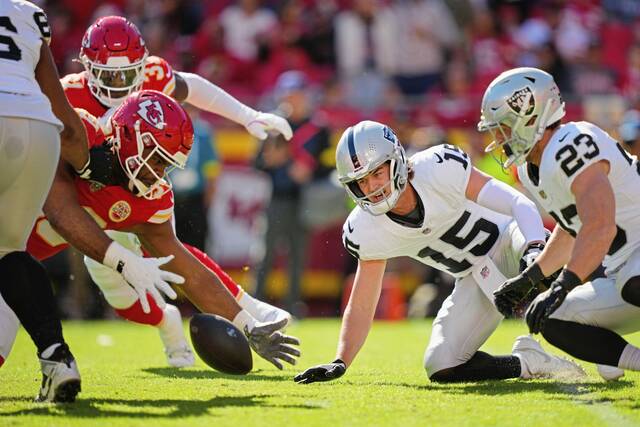 Chiefs defensive tackle Jerry Tillery recovers a fumble by Raiders quarterback Kenny Pickett in the fourth quarter of Sunday’s game at GEHA Field at Arrowhead Stadium in Kansas City, Mo.