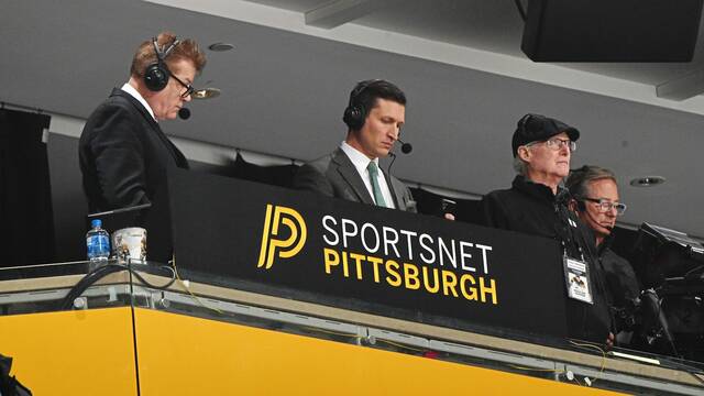 Josh Getzoff (center) has been the play-by-play voice for Penguins broadcasts on SportsNet Pittsburgh since 2023.