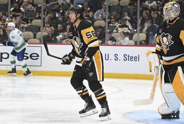 The Penguins’ Kris Letang plays against the Canucks in the second period Tuesday at PPG Paints Arena.
