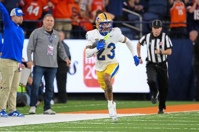 Pitt defensive back Kavir Bains (23) returns an interception against Syracuse during the second half Oct. 18, 2025, at the JMA Wireless Dome.