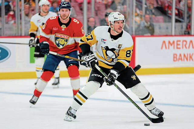 Penguins center Sidney Crosby moves the puck against the Panthers during the first period Thursday.