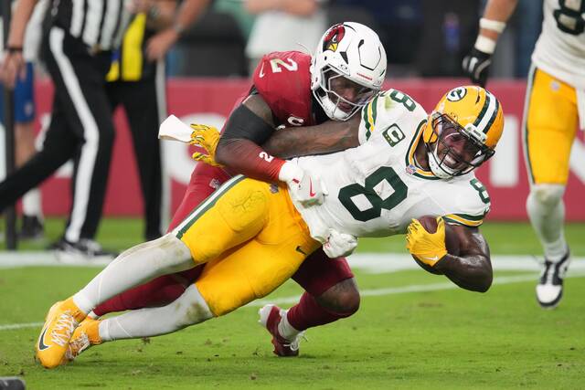Green Bay Packers running back Josh Jacobs stretches during a carry during last week’s win against the Arizona Cardinals. Jacobs has 23 touchdowns in 23 games since signing with Green Bay last year.