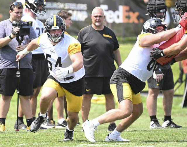 Pittsburgh Steelers center Zach Frazier pulls to block during a training-camp practice in July at Saint Vincent College. Frazier has a calf injury that limited him in practice this week.