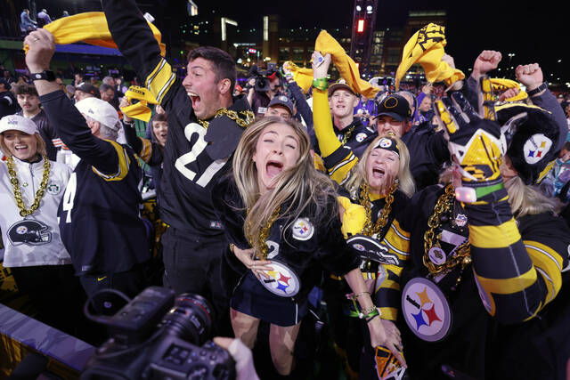 Steelers fans celebrate during the first round of the NFL Draft in Green Bay, Wis., on April 24. Next year, they’ll get to celebrate in Pittsburgh.