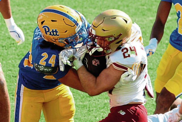 Pitt linebacker Cameron Lindsey (24 left) tackles Boston College running back Bo MacCormack III (24 right) during the fourth quarter Oct. 4, 2025 at Acrisure Stadium.