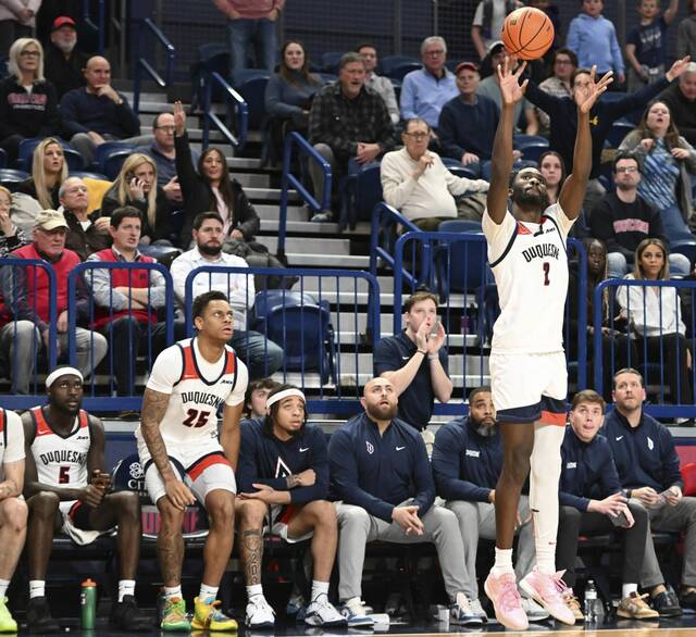 Duquesne’s David Dixon hits a 3-pointer against Saint Joseph’s on Jan. 8, 2025 at UPMC Cooper Fieldhouse.