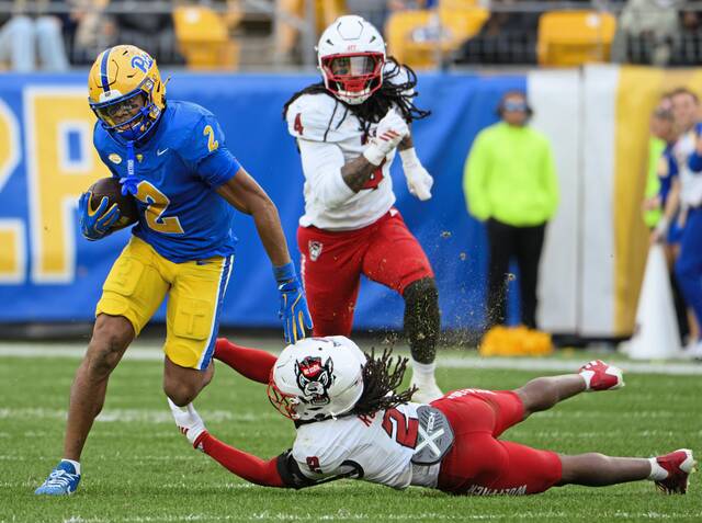 Pitt wide receiver Kenny Johnson evades a tackle by N.C. State's Ronnie Royal III on Saturday, Oct. 25, 2025, at Acrisure Stadium.