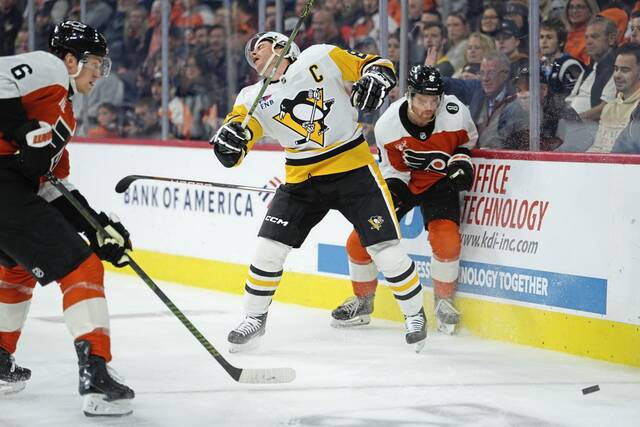 Penguins center Sidney Crosby (87) reacts after a high-sticking penalty against the Flyers in the second period Tuesday.