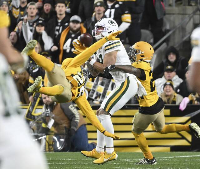 The Packers Christian Watson pulls in a catch pulls in a catch past the Steelers’ Juan Thornhill in the third quarter Sunday Oct. 26, 2025 at Acrisure Stadium.