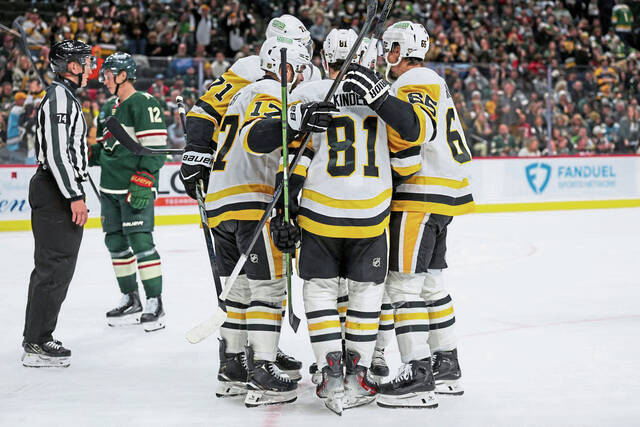 Penguins forward Ben Kindel (81) celebrates his goal against the Wild during the third period Thursday.