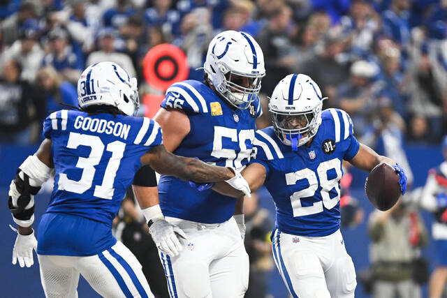 Indianapolis Colts running back Jonathan Taylor (No. 28) celebrates with teammates after scoring a touchdown during last week’s home win against the Tennessee Titans at Lucas Oil Stadium. Taylor leads the NFL in rushing yards and touchdowns.