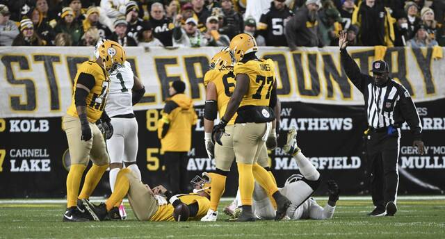 Steelers quarterback Aaron Rodgers stays on the ground after a Packers sack in the fourth quarter Sunday, Oct. 26, 2025 at Acrisure Stadium.