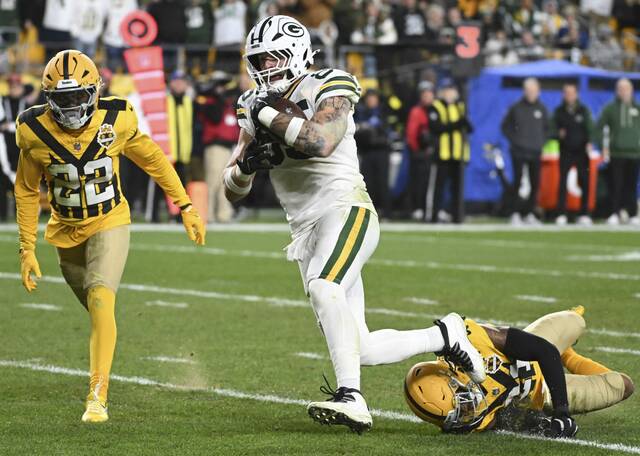 Packers tight end Tucker Kraft avoids the tackle attempt by the Steelers’ Chuck Clark on the way to a fourth quarter Sunday, Oct. 26, 2025 at Acrisure Stadium.