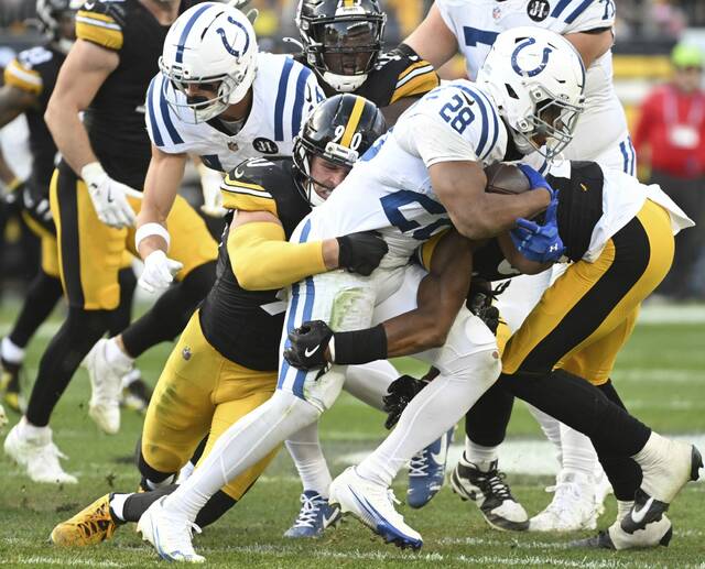 The Steelers’ T.J. Watt takes down Colts running back Jonathan Taylor on Sunday, Nov. 2, 2025, at Acrisure Stadium.
