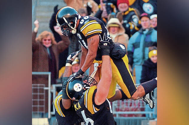 Steelers receiver Hines Ward is hoisted up by Jerome Bettis and Alan Faneca on Nov. 9, 2003, after scoring his second touchdown against the Arizona Cardinals at Heinz Field.